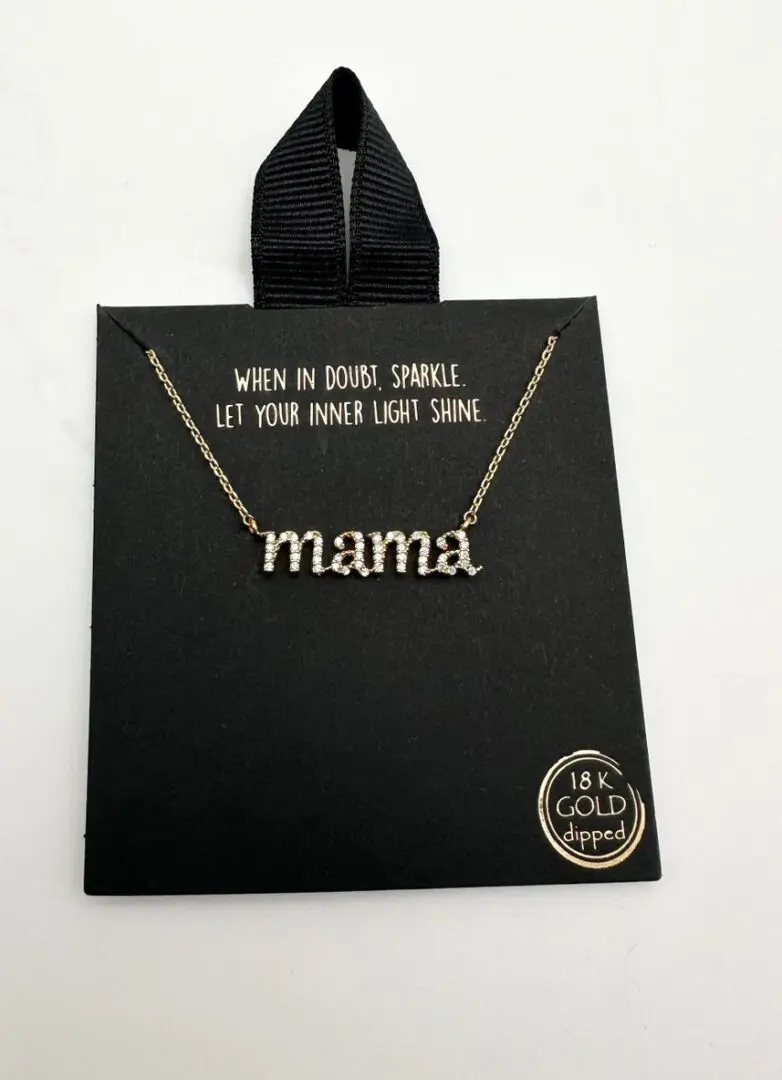 A necklace that says mama on it.