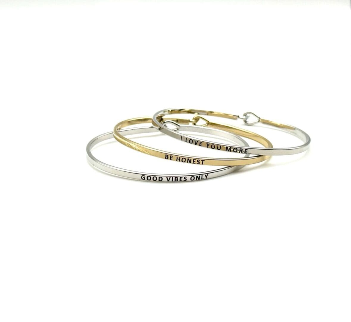 A set of three bracelets with the words " grace over all ".